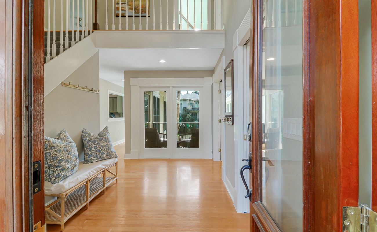 Step into your welcoming retreat where warm wood tones and cozy seating create the perfect arrival moment for your getaway.