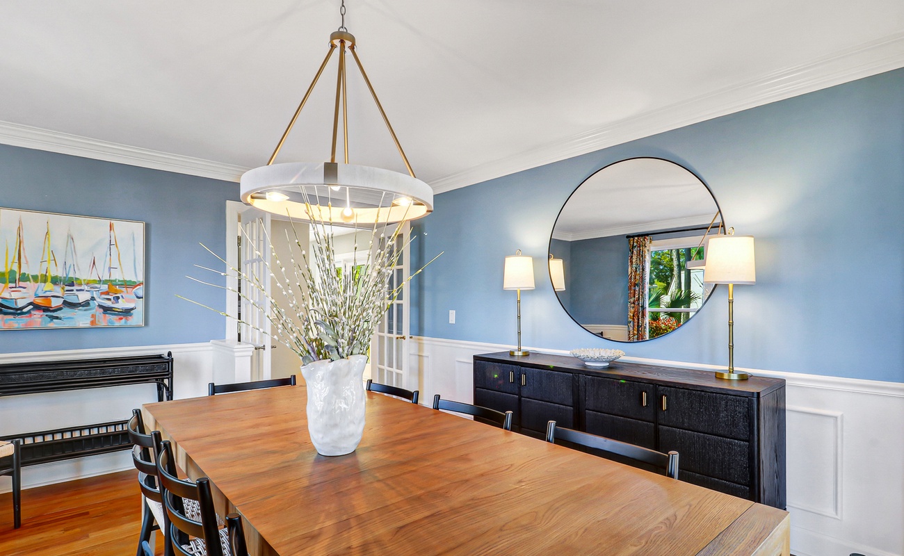 Gather around your elegant dining table where coastal charm meets sophisticated style in calming blue tones.
