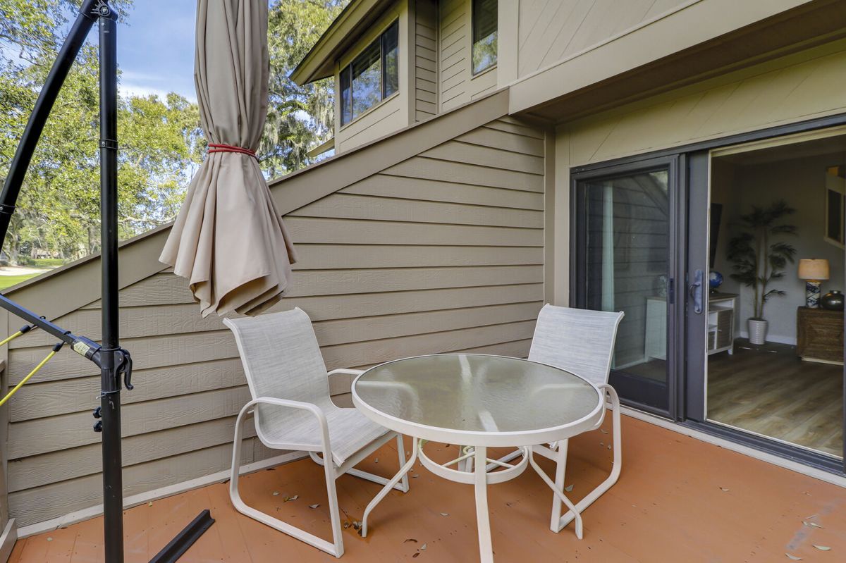 Back patio with beautiful views of Harbour Town Golf Links. Spacious and table and chairs make for perfect outdoor dining.