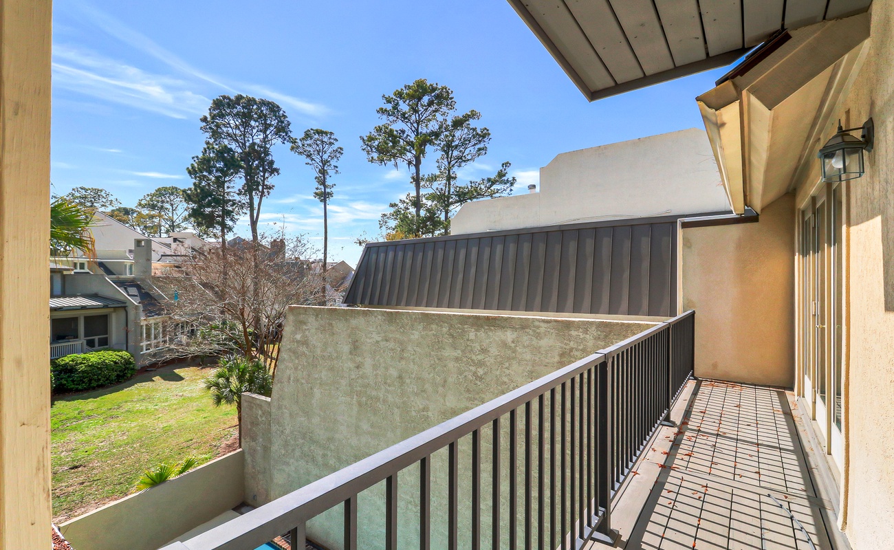 Your private balcony overlooks peaceful gardens and trees, perfect for morning coffee or evening relaxation in the fresh air.