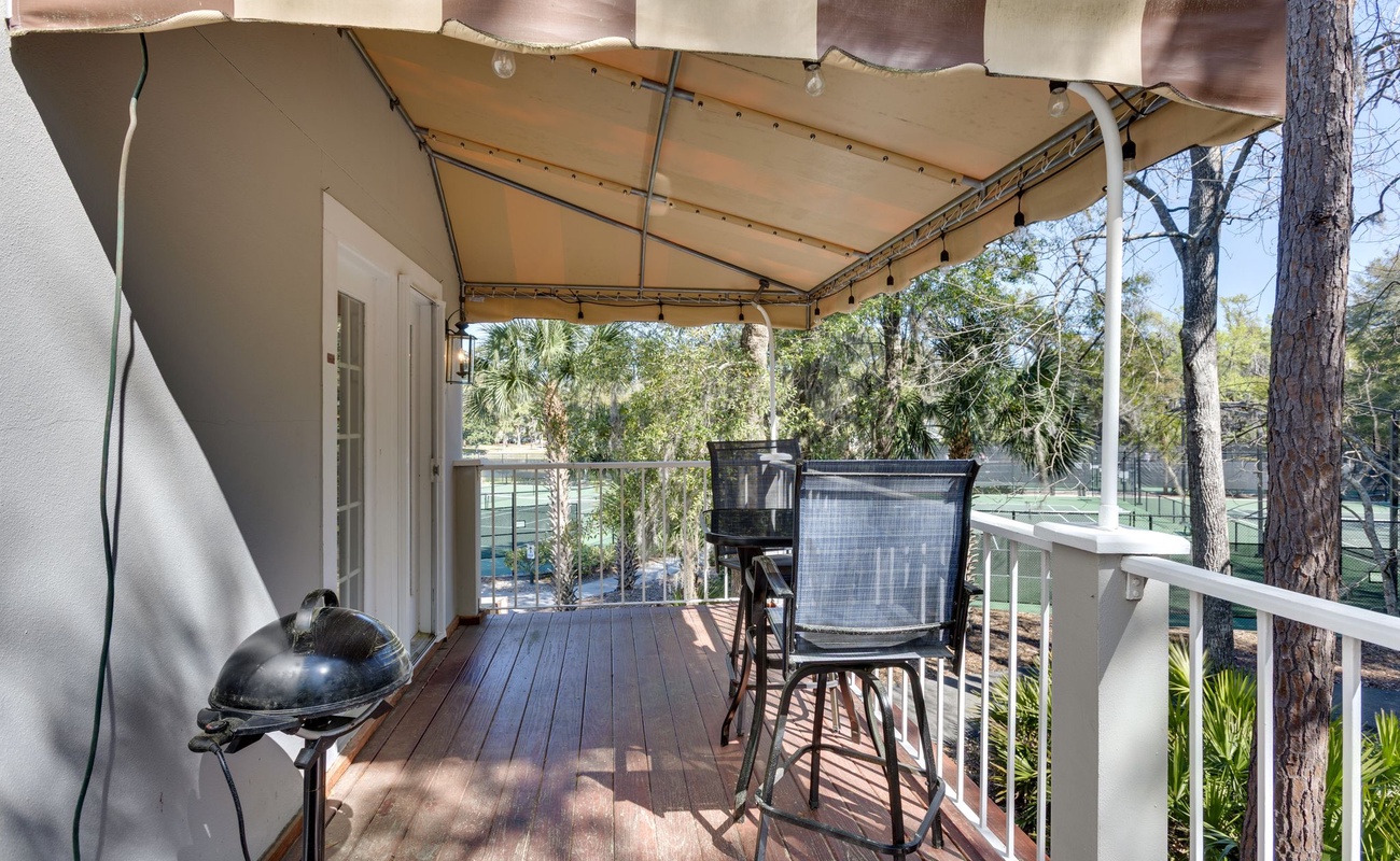 Your private covered deck offers shaded dining and BBQ space with peaceful garden views for memorable outdoor meals.