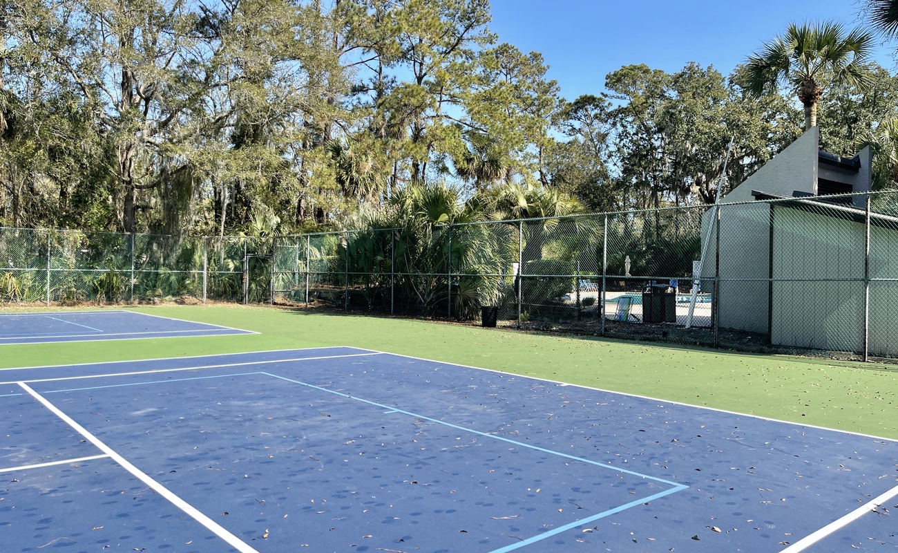 Community Tennis Courts next to the Community Pool