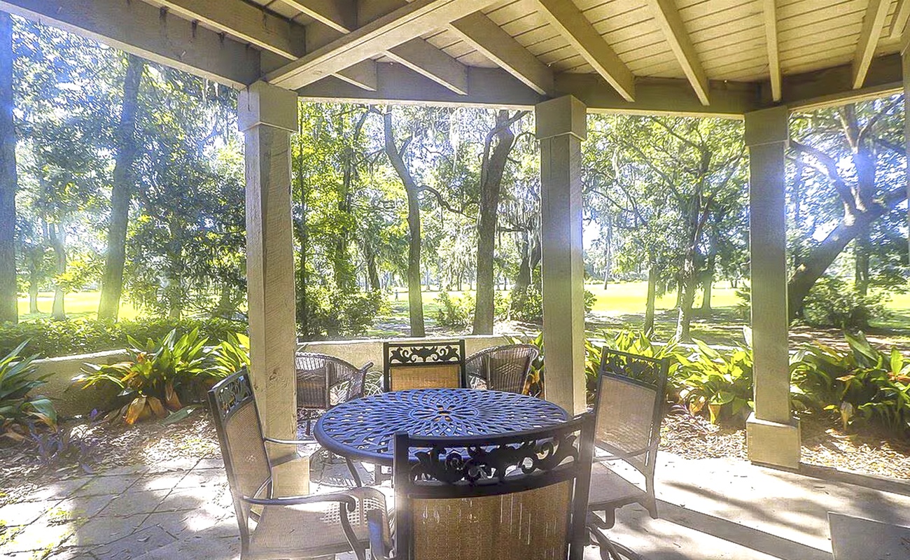Your private covered patio overlooks peaceful gardens, where morning coffee and evening meals become magical moments surrounded by nature.