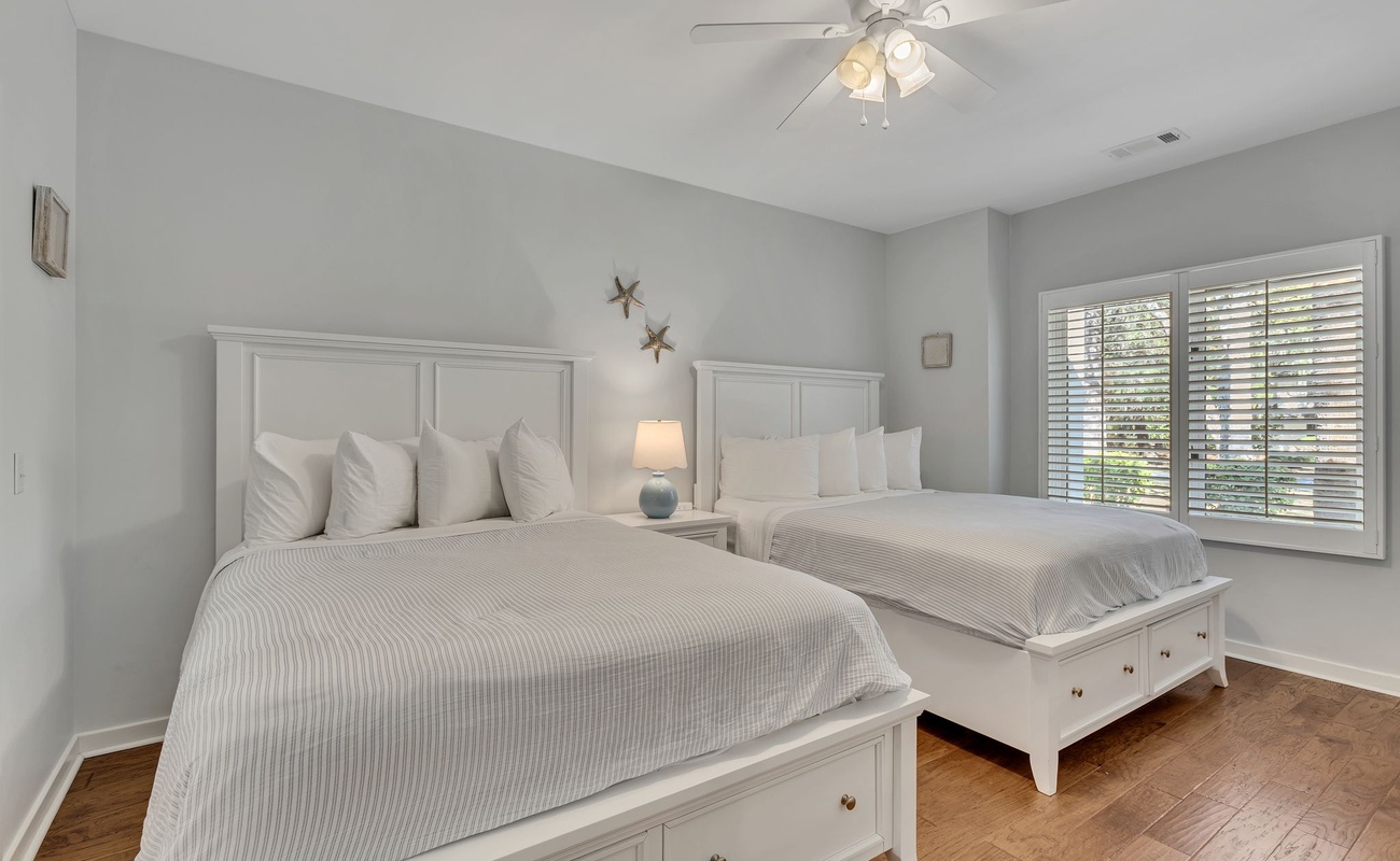 Drift off to sleep in these comfortable double beds with crisp linens and gentle ceiling fan breeze.