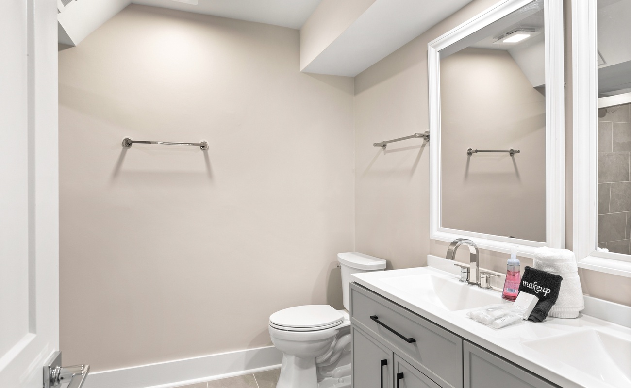 Your private bathroom features modern vanity, fresh towels, and thoughtful amenities for your comfort.
