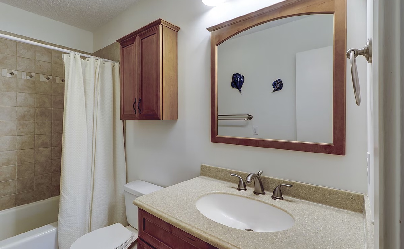 Your private bathroom features warm wood vanity with granite counters, plus a relaxing tub-shower combo.