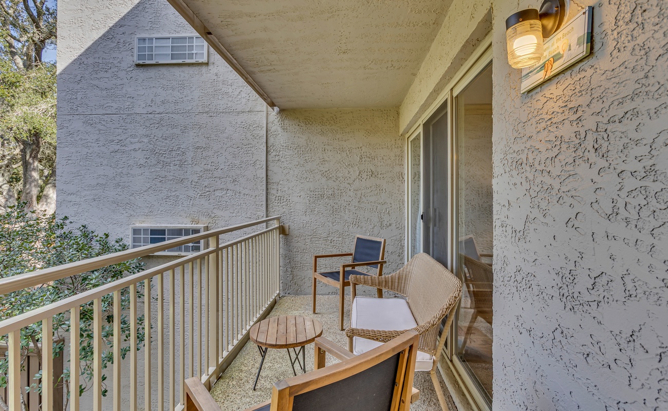 Step onto your private balcony where morning coffee feels perfect among stylish furnishings and peaceful surroundings.