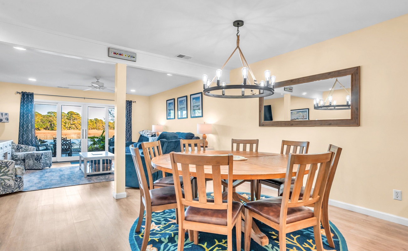 Gather around your elegant dining table for memorable meals, with modern lighting creating the perfect ambiance for family dinners.