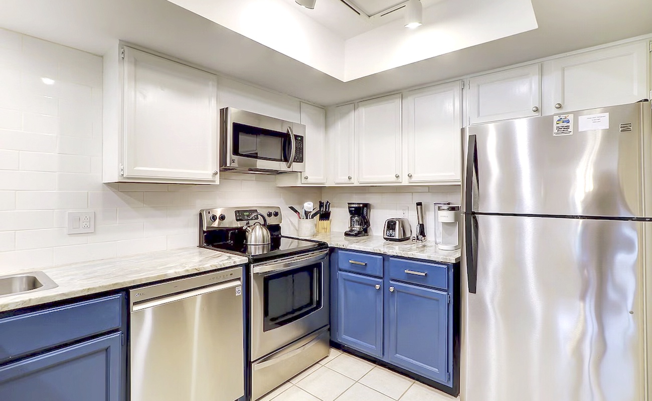 Your fully equipped kitchen features stainless steel appliances and granite counters for effortless meal preparation.