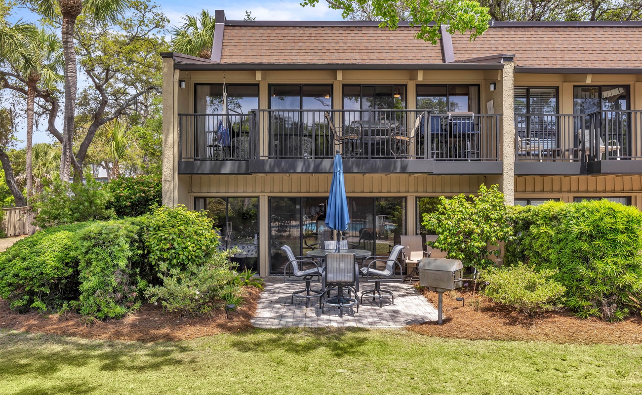 Private Patio Overlooking Community Pool with Charcoal Grill and Beach Path