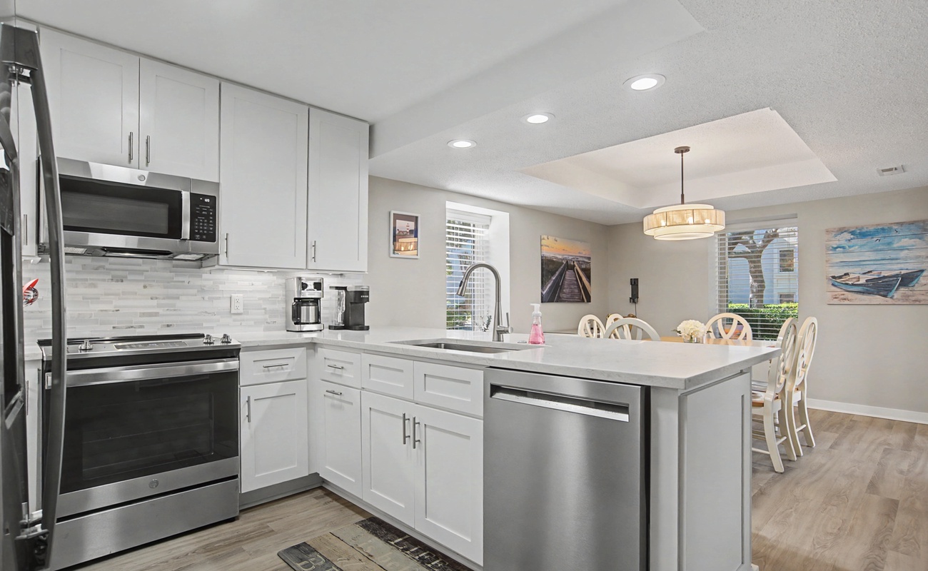 Your fully equipped kitchen features modern appliances and a convenient island for cooking and dining together.