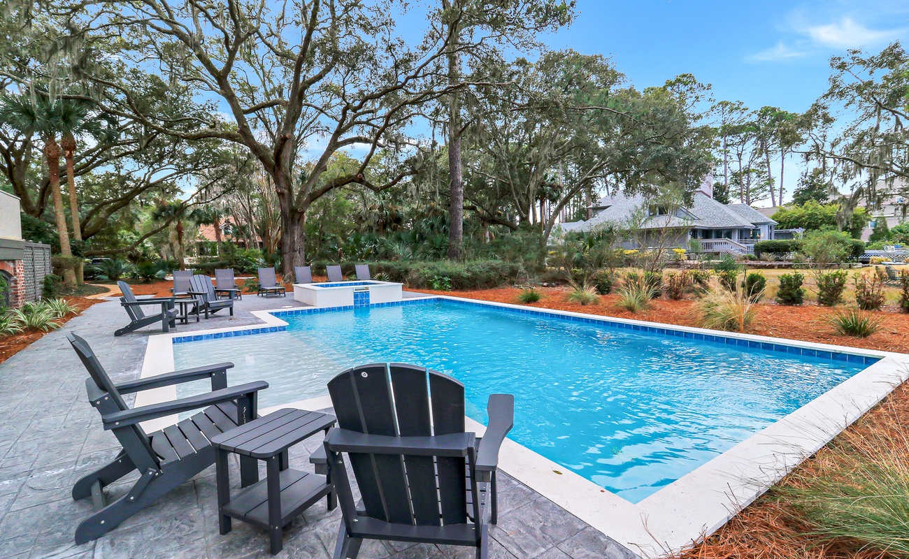 Jump into your private oasis surrounded by lush landscaping and comfortable poolside loungers for ultimate relaxation.