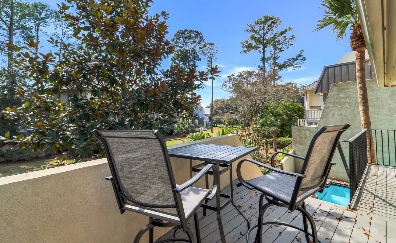 Sip your morning coffee on your private balcony, overlooking lush gardens and pool views in this peaceful tropical retreat.