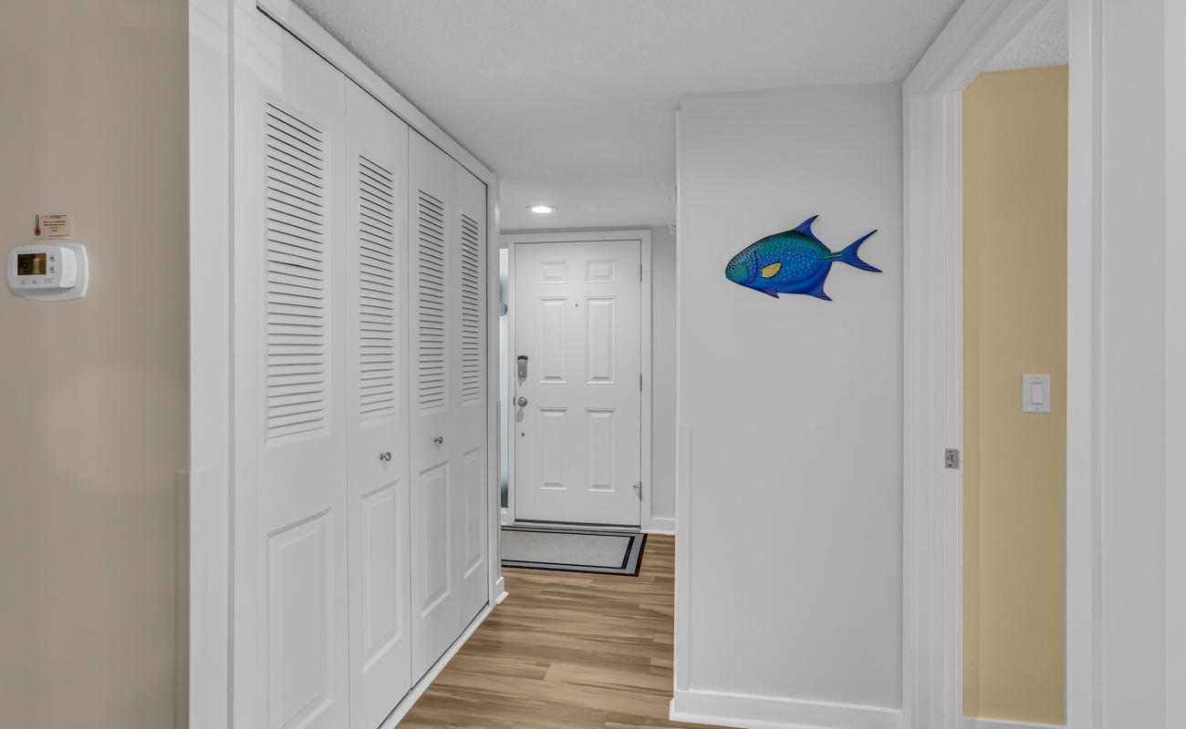 Step into your coastal retreat with nautical charm welcoming you home. The bright hallway features convenient storage for all your belongings.