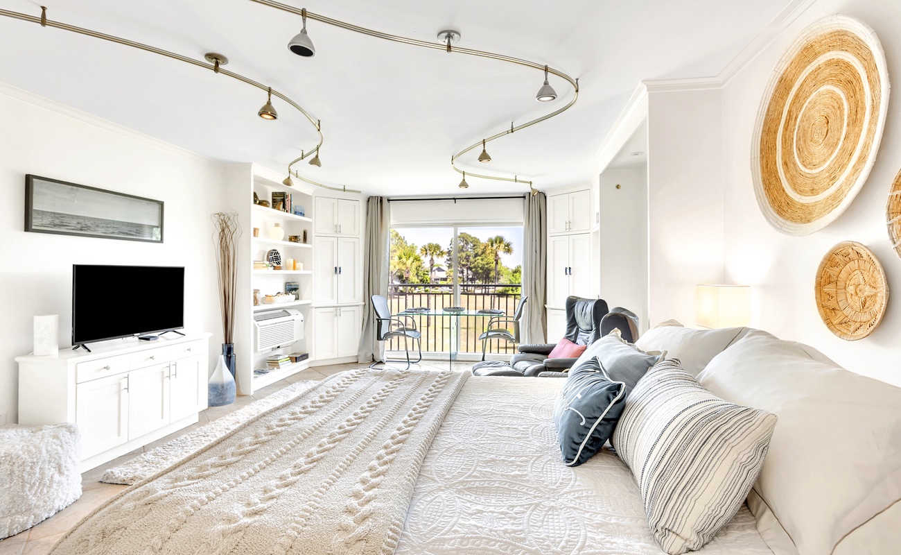 Settle into your bright, airy bedroom where coastal charm meets modern comfort. Natural textures and soft linens create the perfect retreat.