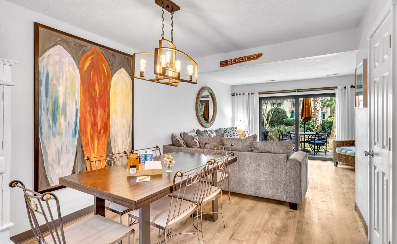 Unwind in your bright, coastal-themed living space with stylish furnishings and beach artwork that sets the perfect vacation mood.