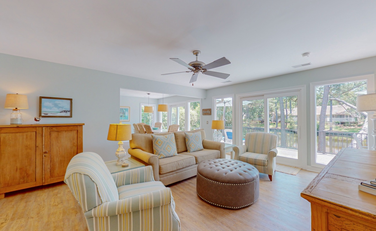 Relax in your bright living space with canal views, comfortable seating, and coastal touches that make you feel instantly at home.