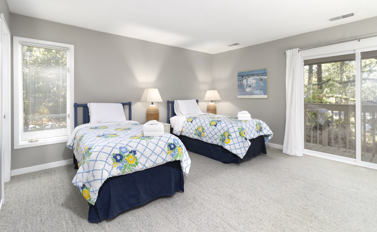 Guest Bedroom with Twin Bed and Access to Patio