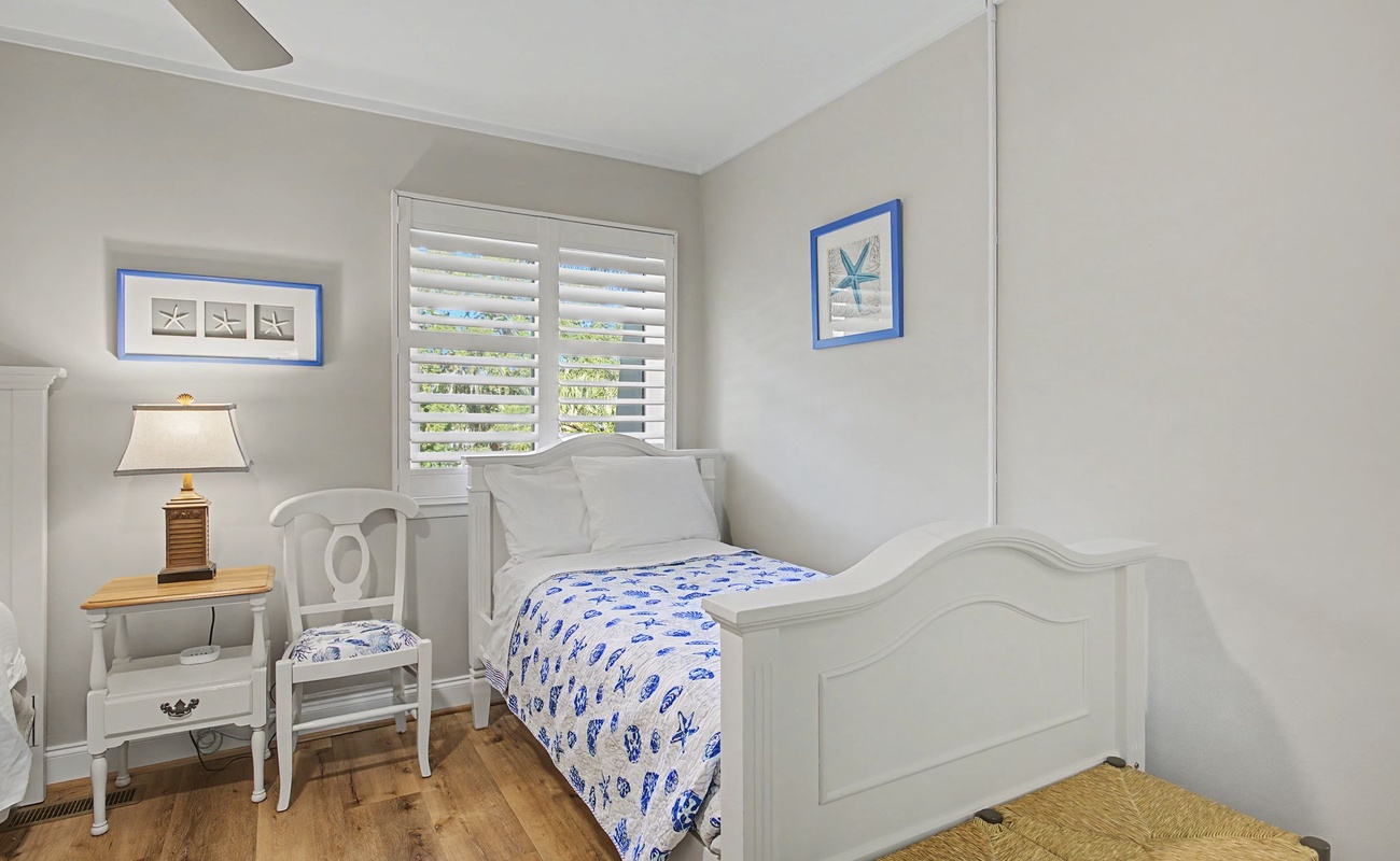 Drift off in this charming coastal bedroom where soft blues and whites create your peaceful seaside sanctuary.