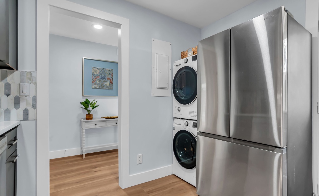 Your modern kitchen nook features stainless steel appliances and convenient in-unit washer and dryer for effortless laundry during your stay.