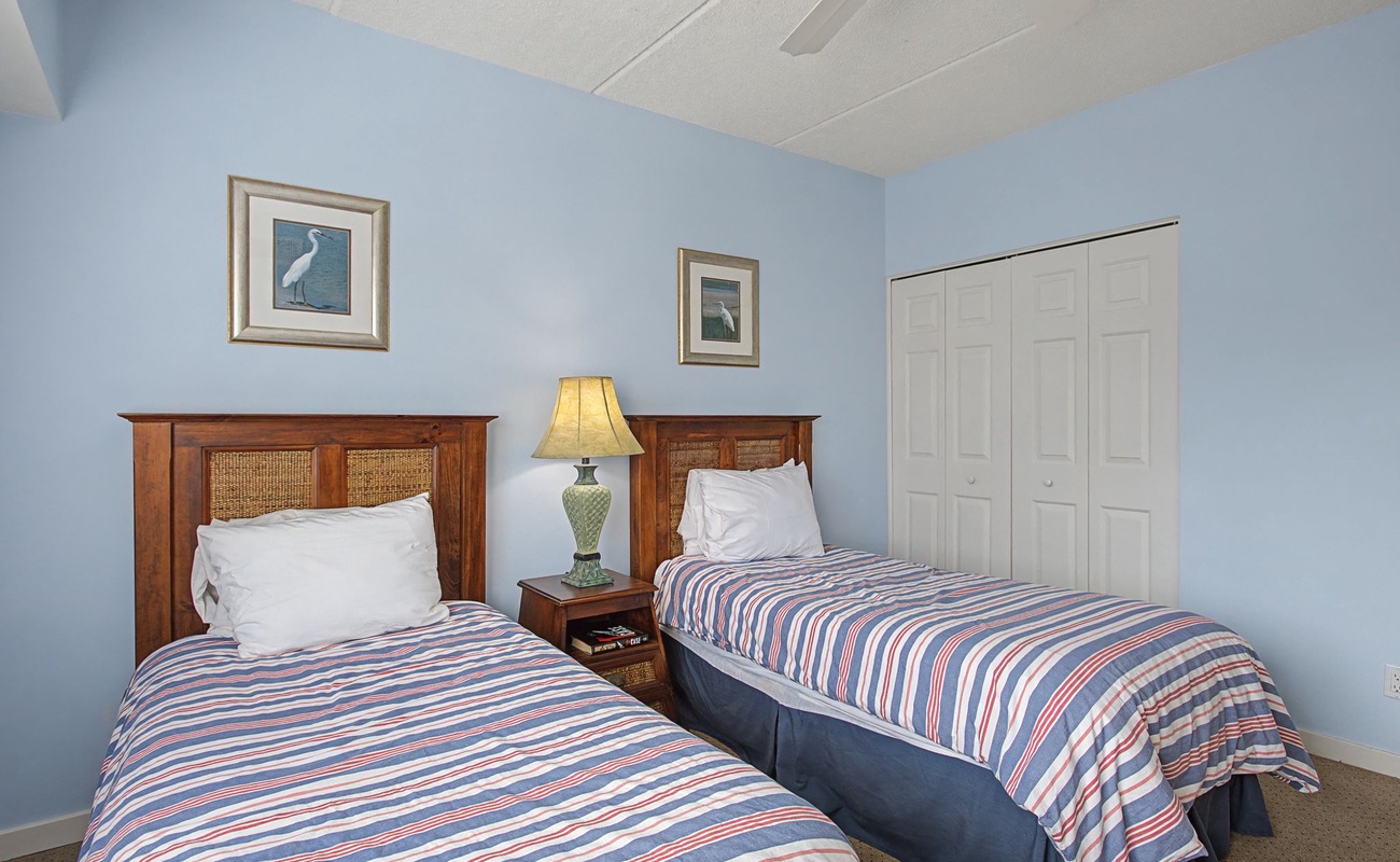 Unwind in this peaceful twin bedroom with crisp linens and coastal touches that create your perfect coastal retreat.