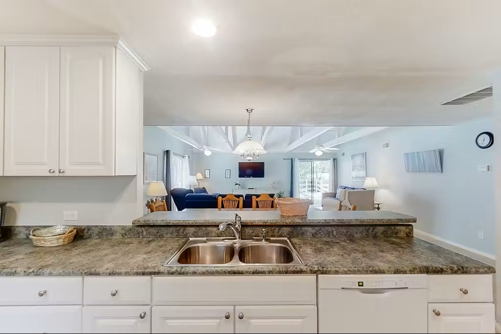 Your spacious kitchen flows into a bright living area, perfect for preparing meals while staying connected with family and friends.