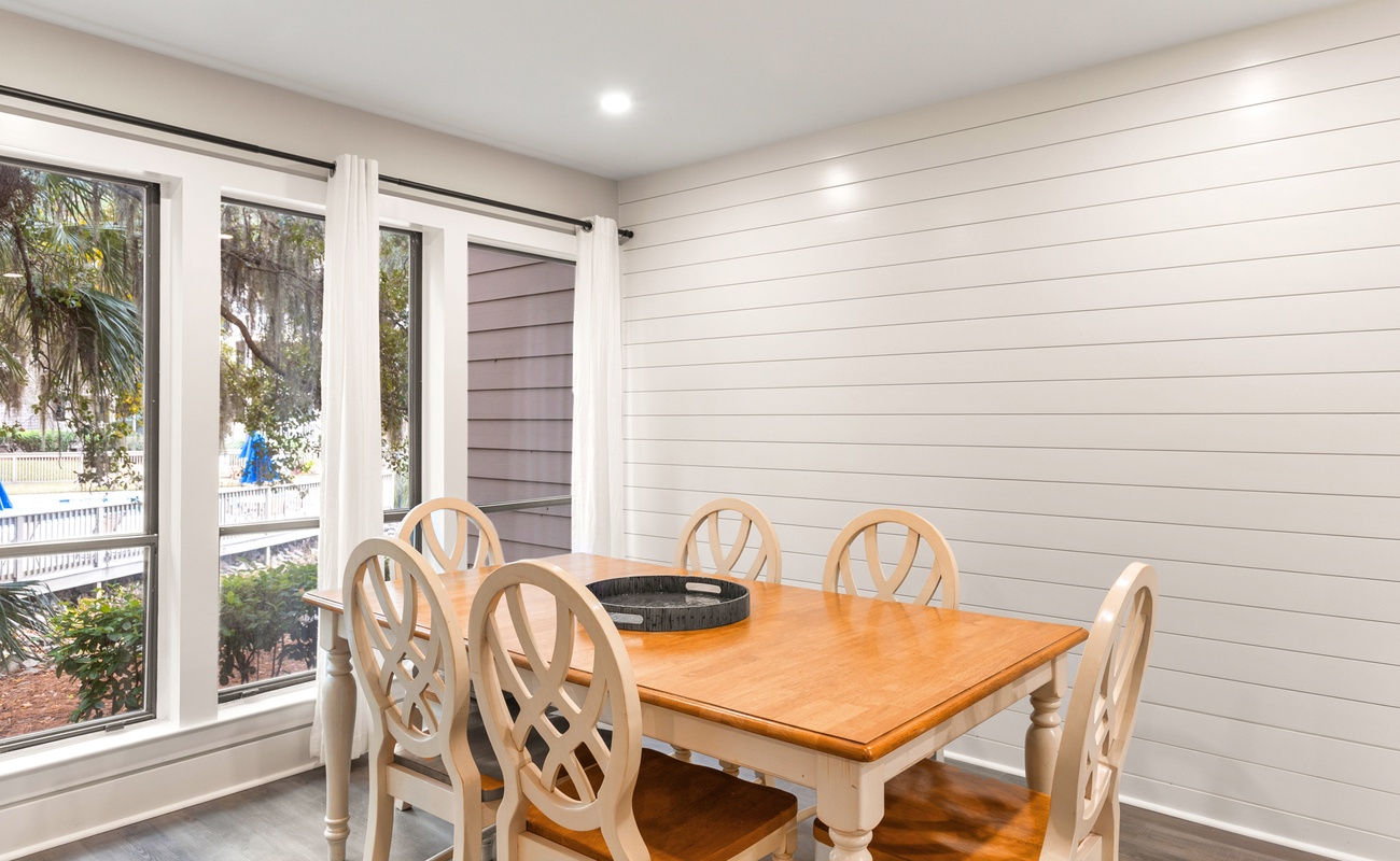 Gather around this charming dining table where your family meals become treasured memories, surrounded by coastal charm and natural light.