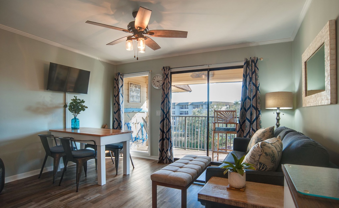 Your bright living space features modern furnishings and opens to a private balcony with lovely views—perfect for morning coffee or evening relaxation.