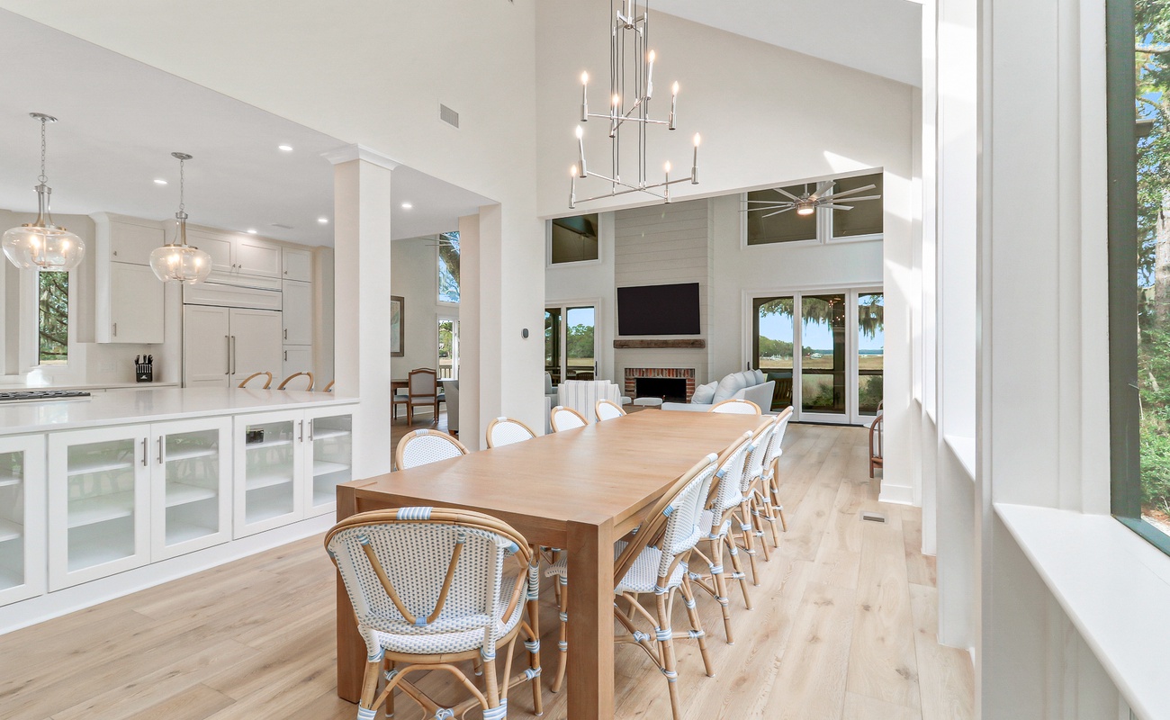 Gather around this stunning dining table where your group will share memorable meals in bright, modern elegance.