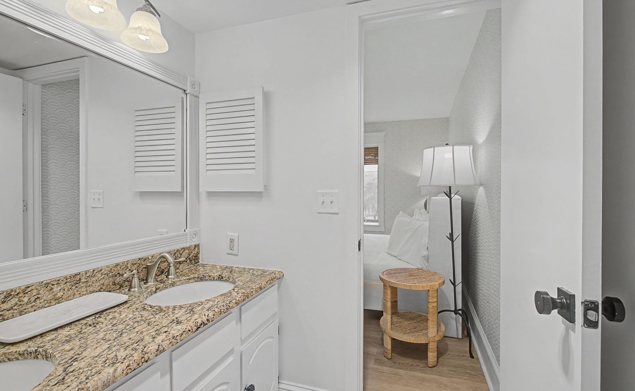Your pristine bathroom features granite countertops and thoughtful lighting, creating a spa-like sanctuary for your daily routine.