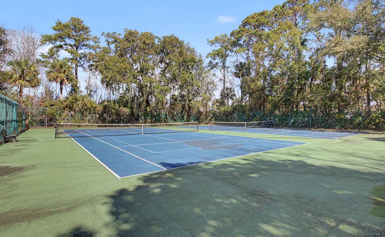 Challenge yourself on this private tennis court surrounded by lush tropical trees for an energizing match in paradise.