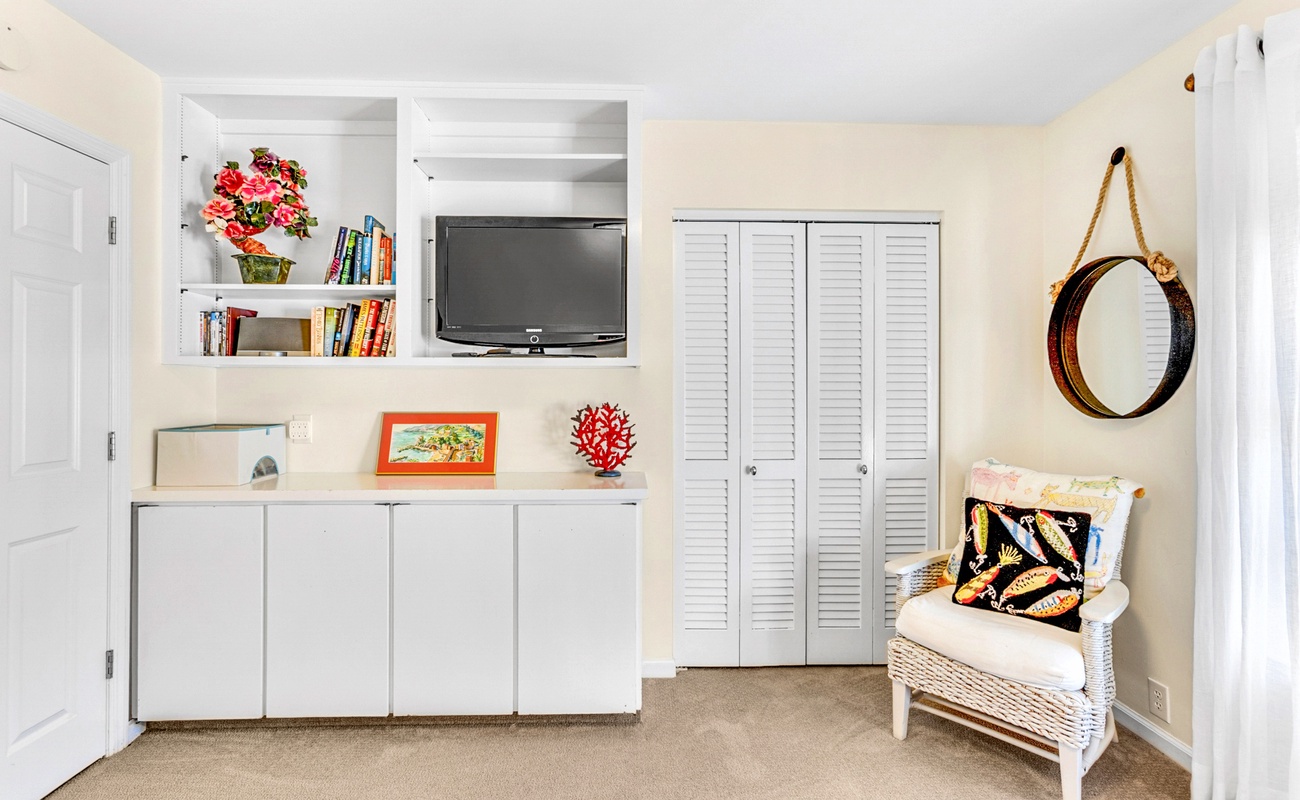 Unwind in your bright coastal retreat with built-in entertainment center, cozy reading nook, and charming nautical touches.