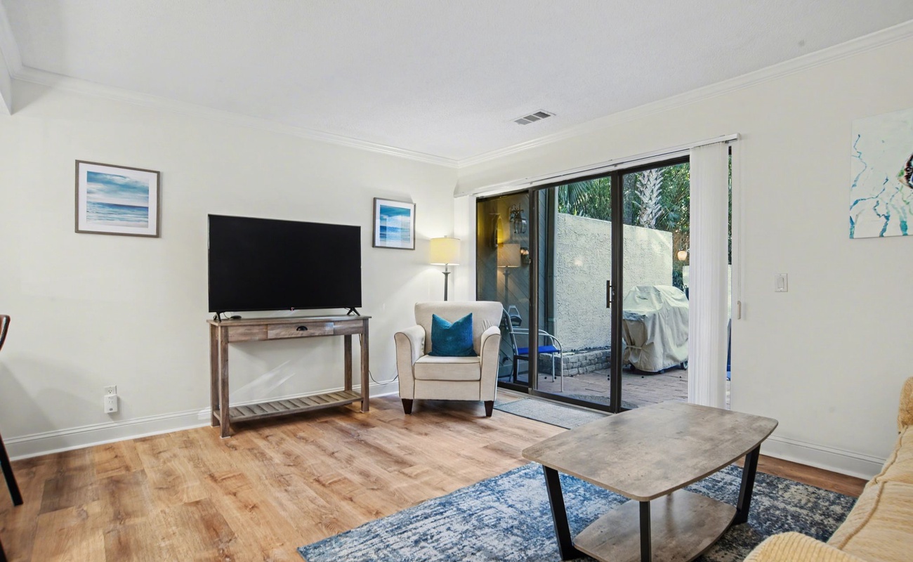 Unwind in your bright living room where comfortable seating and natural light create the perfect space for relaxation.