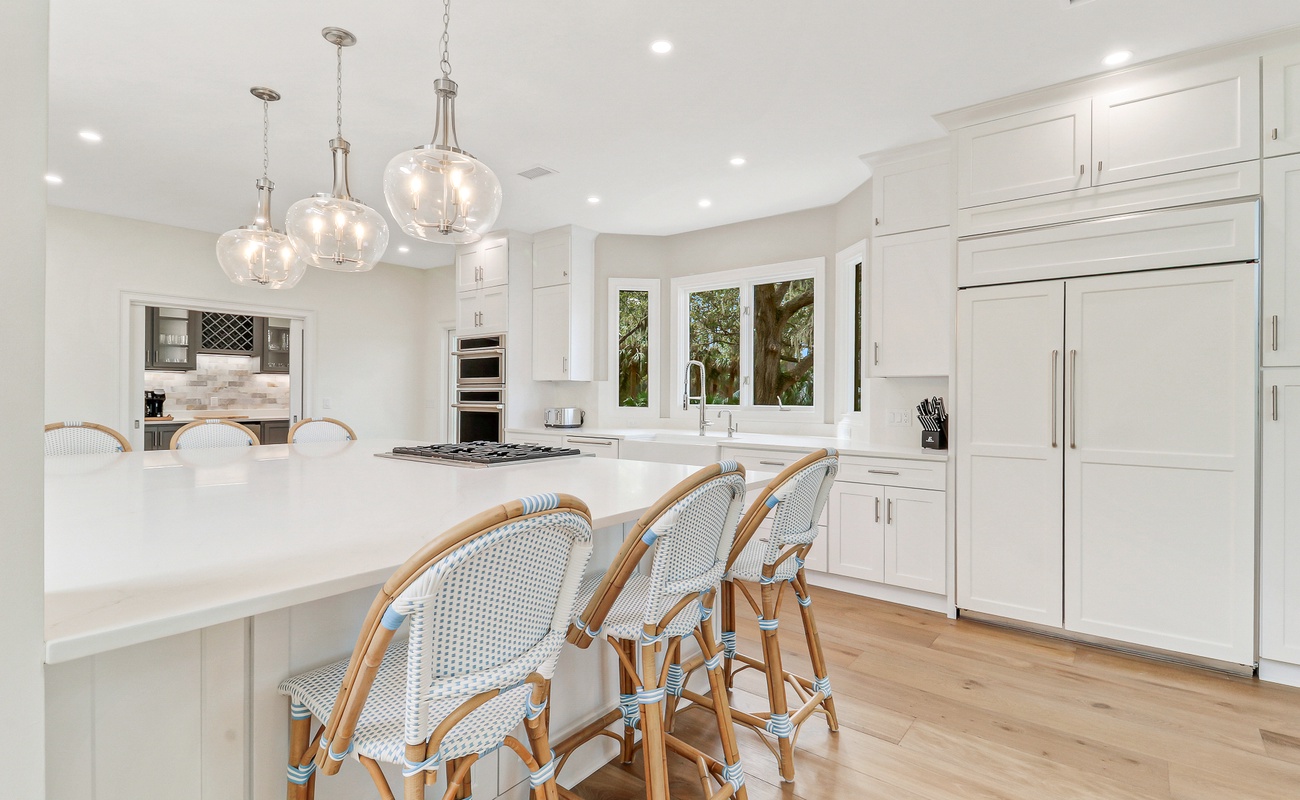 Your dream kitchen awaits with elegant pendant lighting, spacious marble counters, and premium appliances perfect for creating memorable meals.