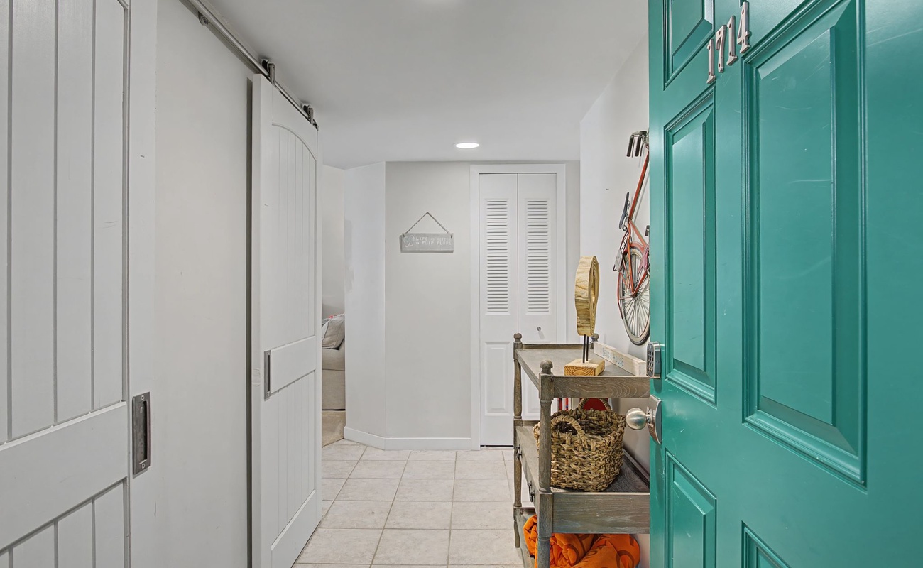 Your private laundry room features barn doors and turquoise cabinets, creating a cheerful space for all your washing needs.
