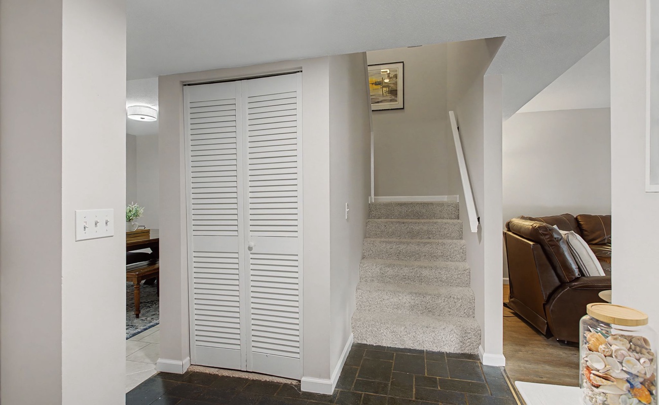 Relax in your private basement retreat with plush leather seating and convenient storage solutions for all your vacation essentials.