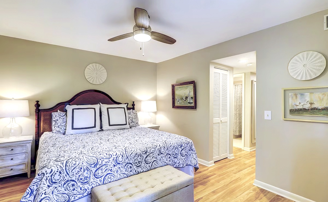 You'll love this elegant bedroom with its plush paisley bedding and peaceful ambiance, perfect for restful nights.