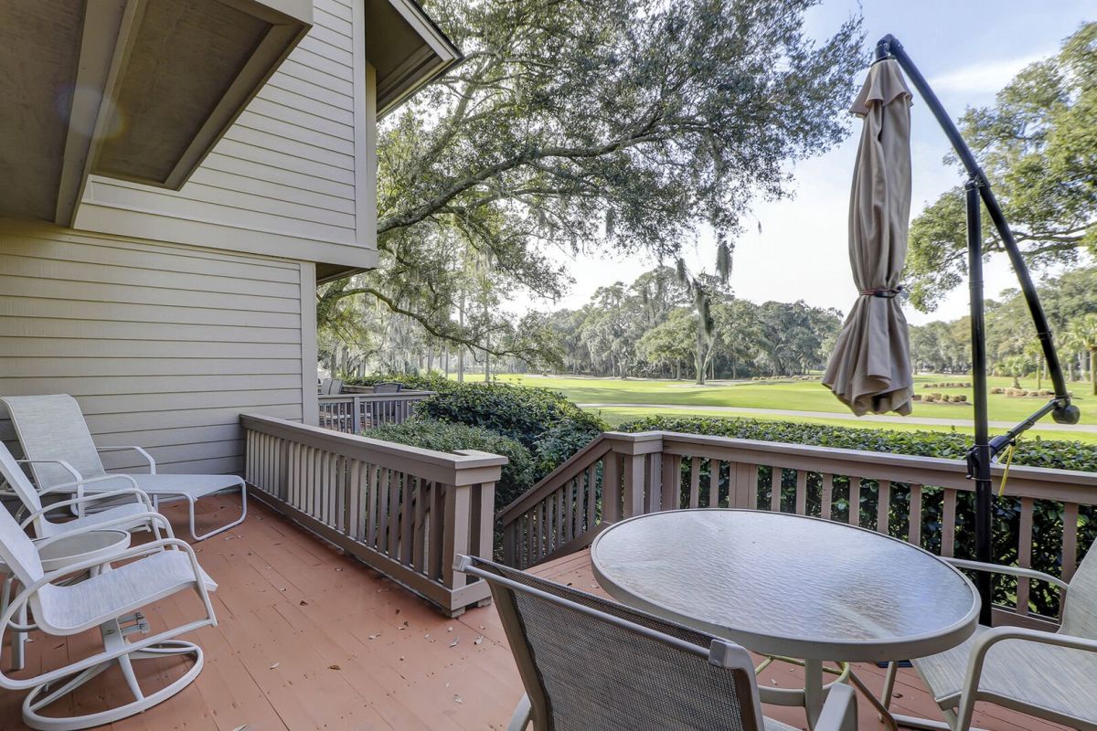 Back patio with beautiful views of Harbour Town Golf Links. Spacious and several tables and chairs make for perfect outdoor dining.