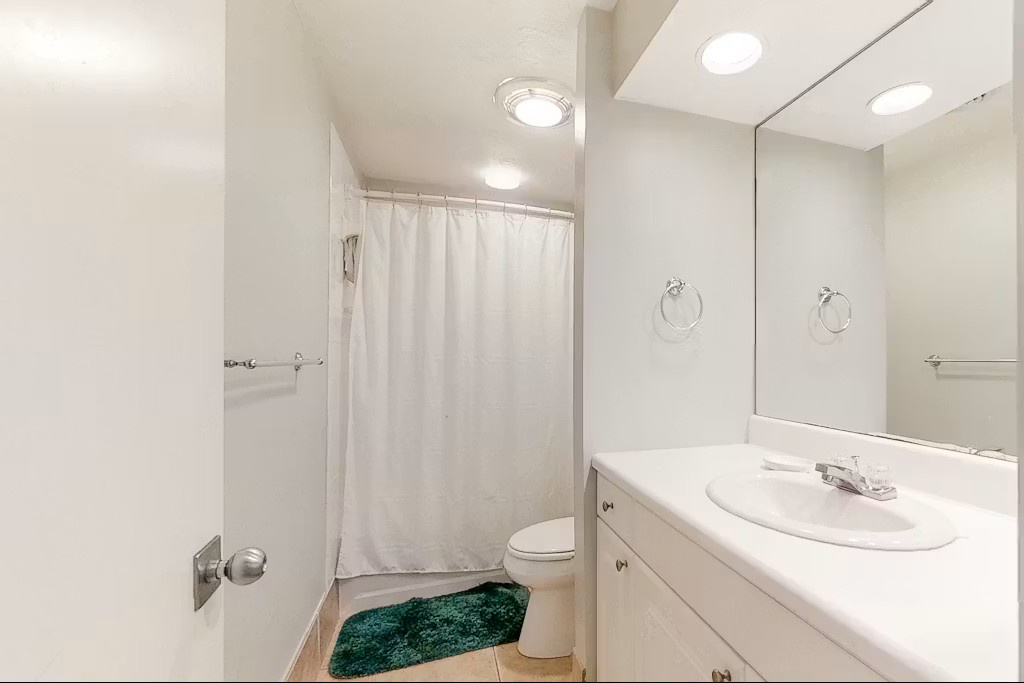 Step into your private bathroom with everything you need for a comfortable stay - spacious vanity, shower, and thoughtful touches.