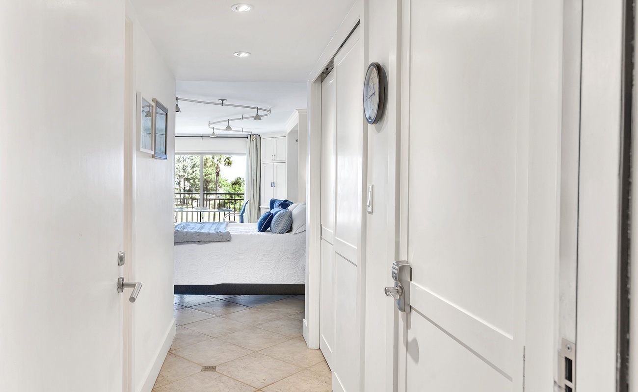 Step into your bright, modern retreat where the master bedroom awaits with a balcony view and coastal charm.