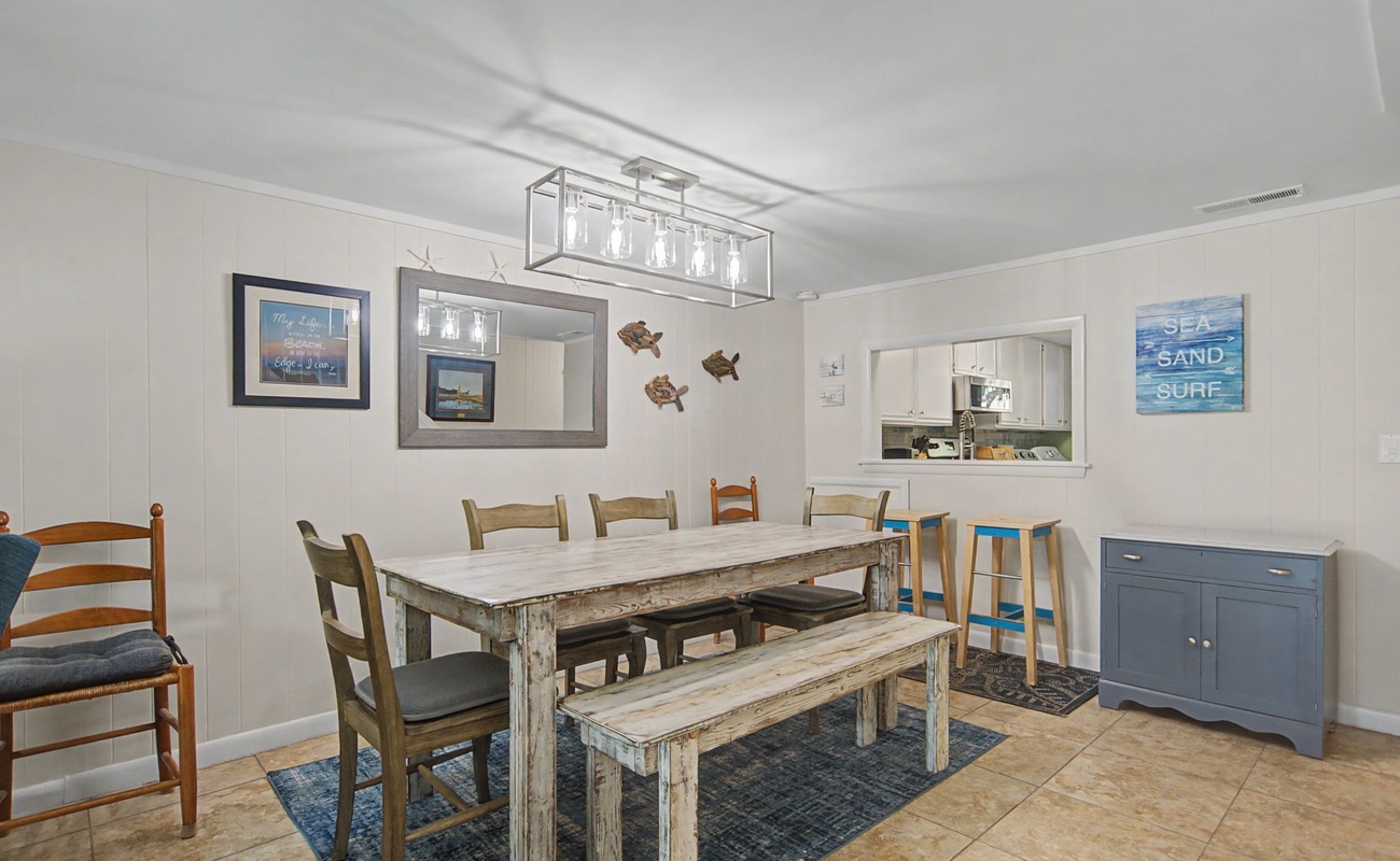 Gather around your spacious dining table where coastal charm meets comfort, perfect for sharing meals and making memories together.