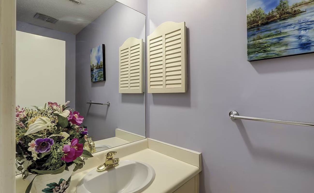 Freshen up in your private bathroom featuring calming artwork and thoughtful touches that make your stay feel like home.