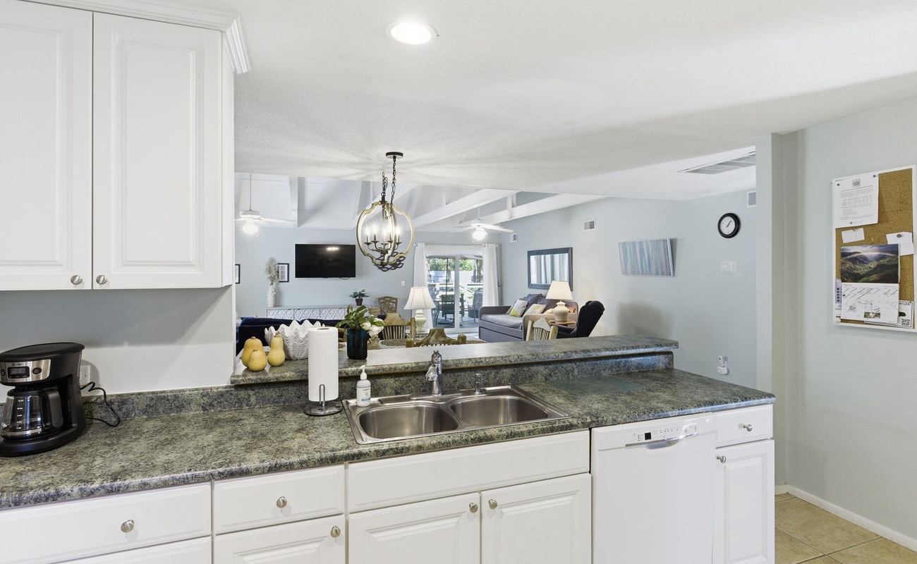 Your fully equipped kitchen opens seamlessly into the bright living area, perfect for preparing meals while staying connected with family and friends.