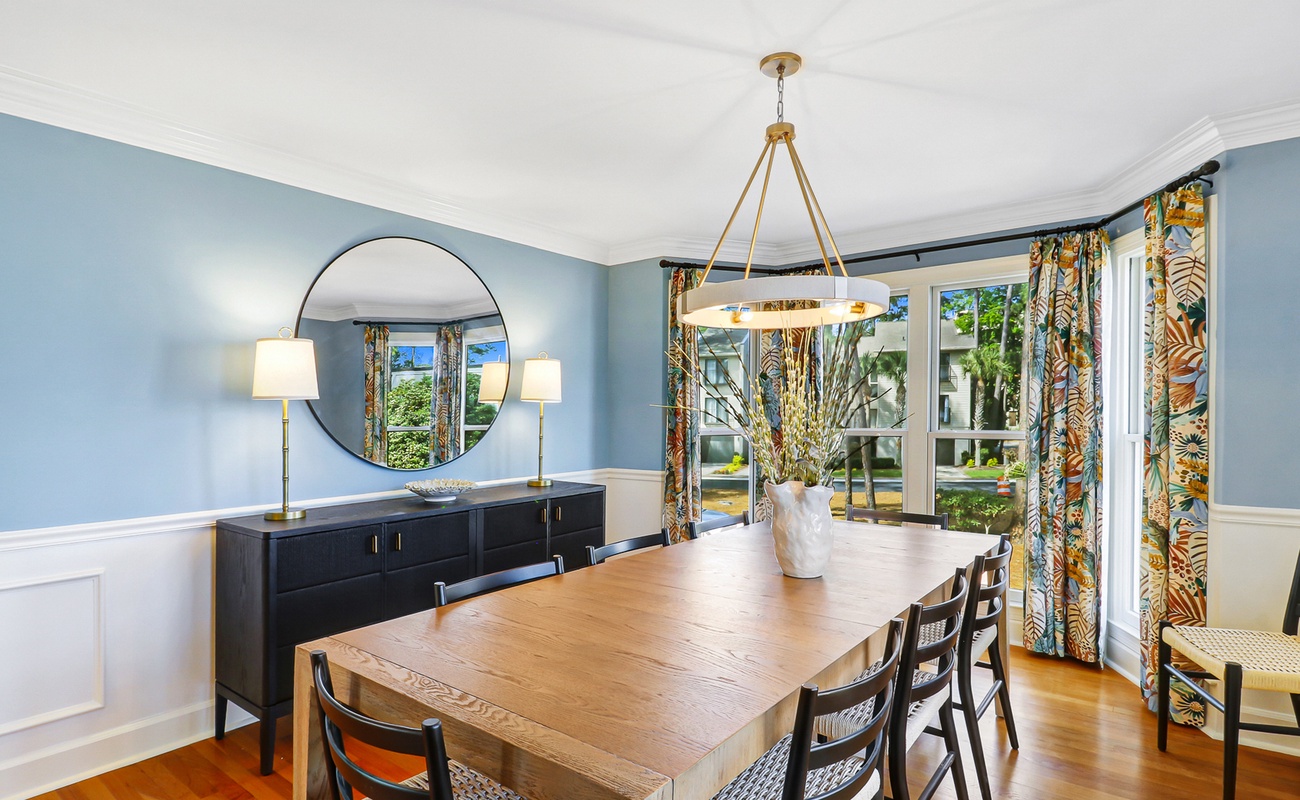 Gather around this beautiful dining table where memorable meals await in your elegant, sunlit space.