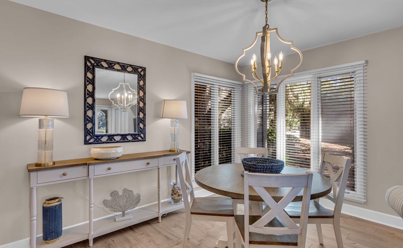 Your elegant dining space features warm wood tones and soft lighting, perfect for intimate meals together.