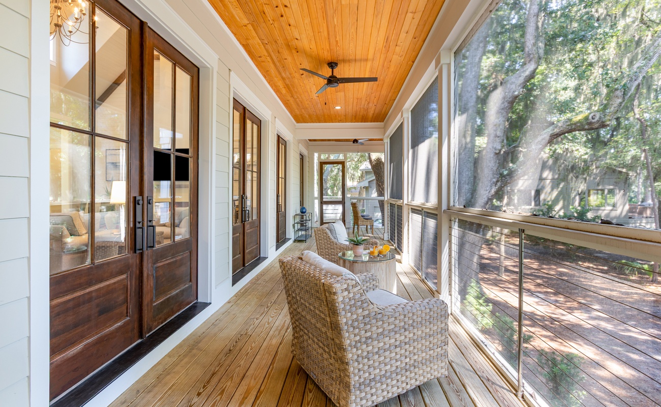 Screened Wraparound Porch with Views of Lagoon, Private Pool, and Glimpses of Golf Course