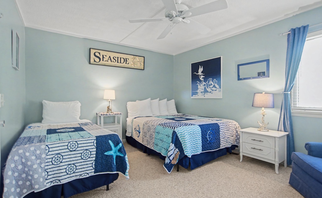 Drift off to sleep in this coastal-themed bedroom where ocean blues and nautical touches create your perfect seaside retreat.