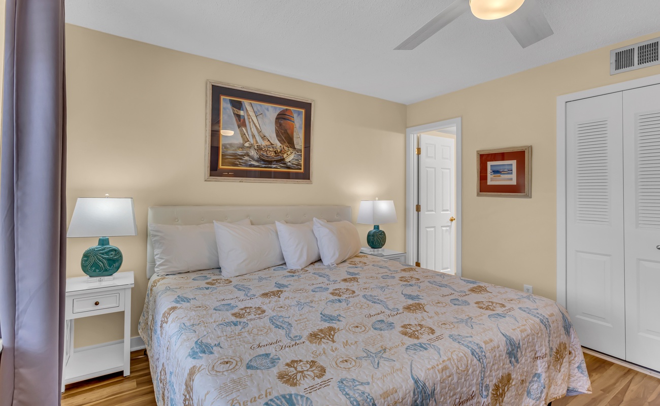 Drift off in your coastal-themed bedroom with soft linens, nautical artwork, and gentle ceiling fan keeping you comfortable all night.