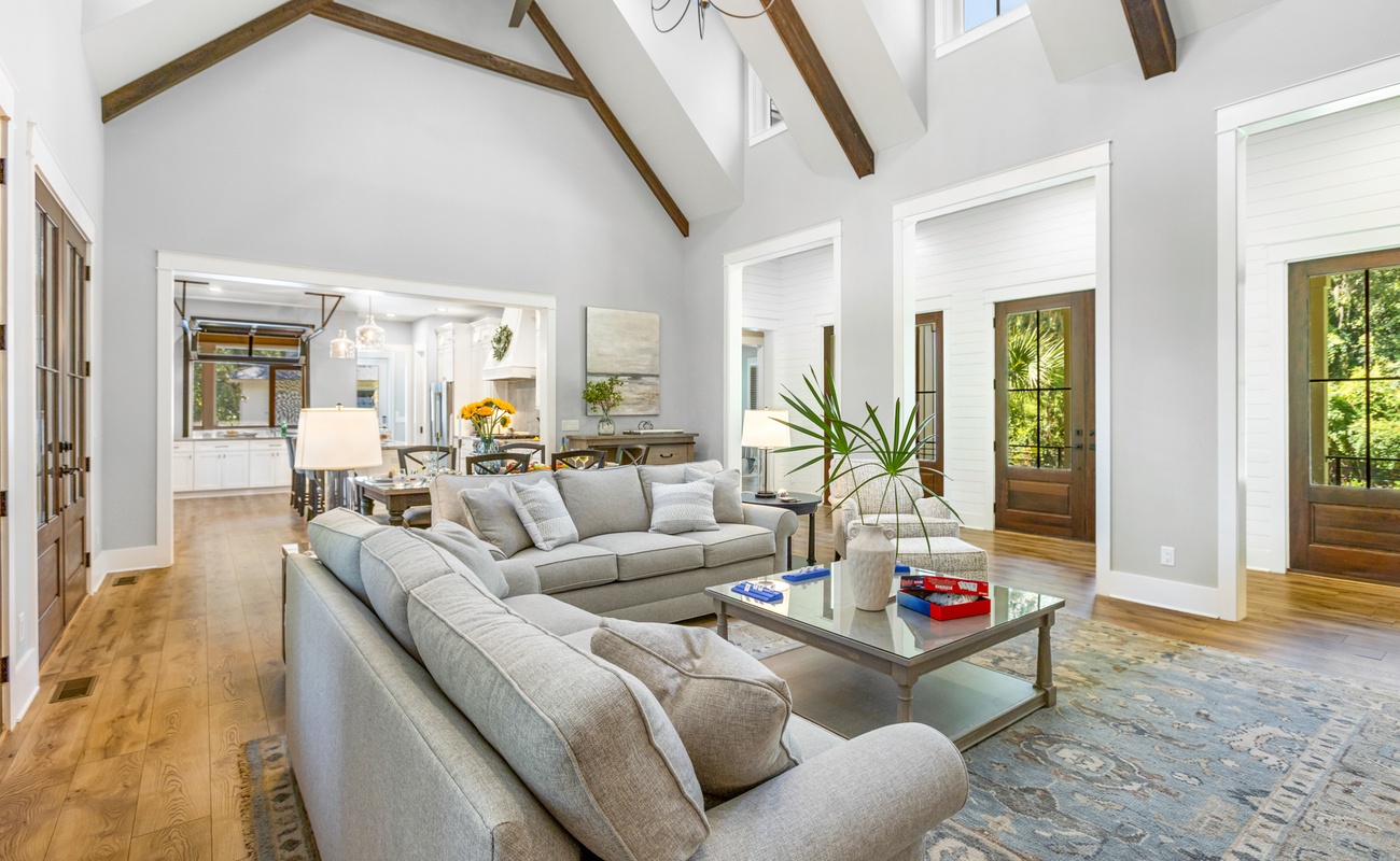Open Living Space with High-Vaulted Ceilings and Wraparound Porch