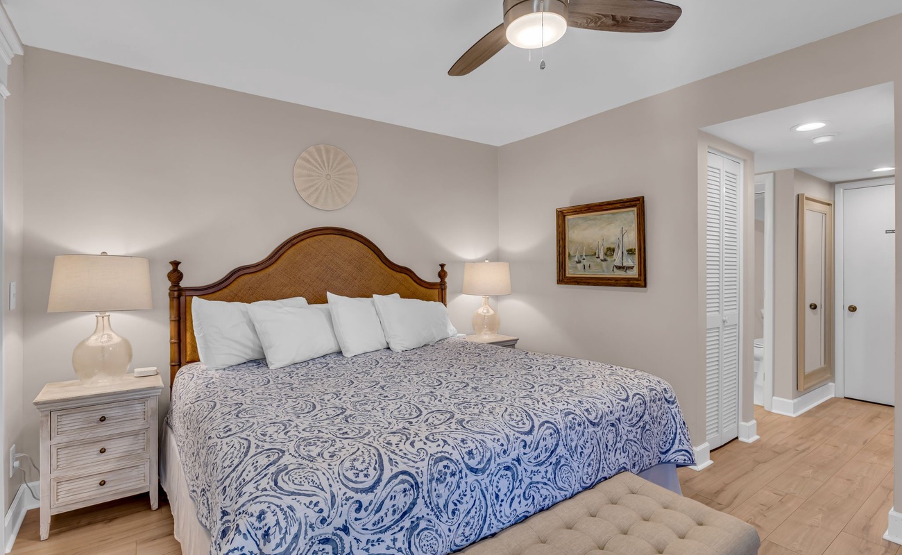 Drift off peacefully in your elegant master bedroom, complete with plush linens and gentle ceiling fan keeping you comfortable all night.